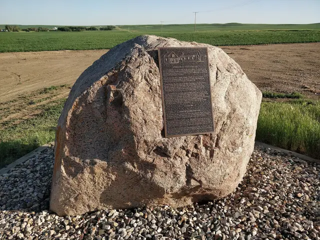 Tribute to Old Ferland plaque on a boulder